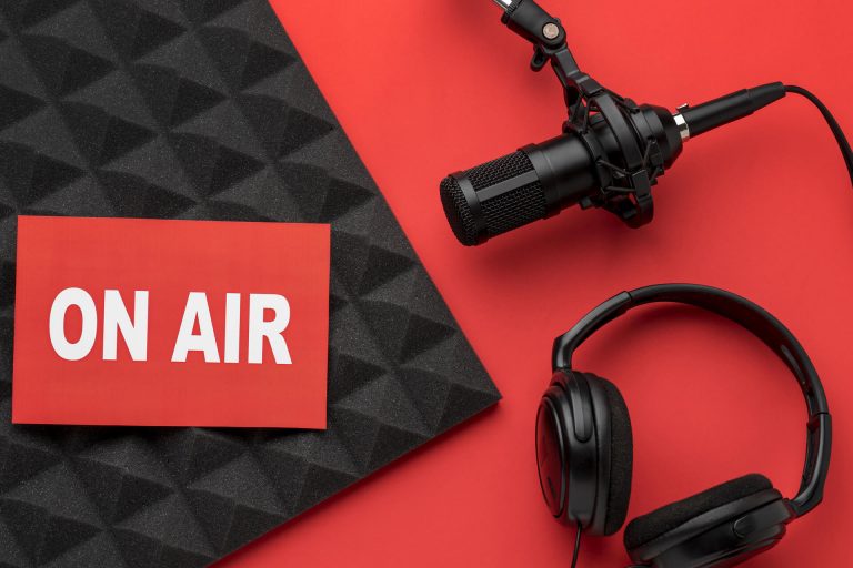 Professional radio jingle production studio &mdash; microphone, headphones and an ON AIR sign